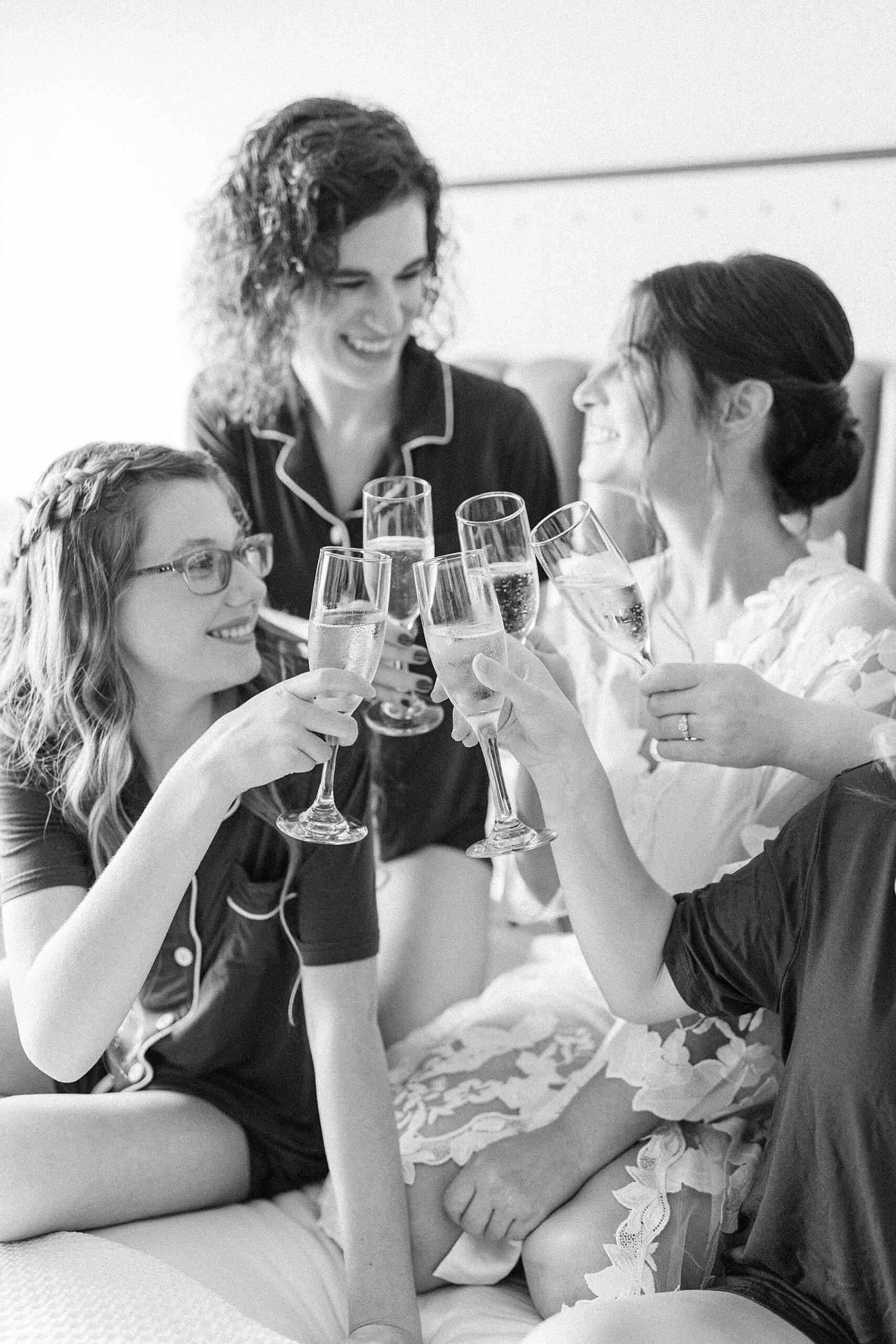 black and white bridesmaids champagne toast