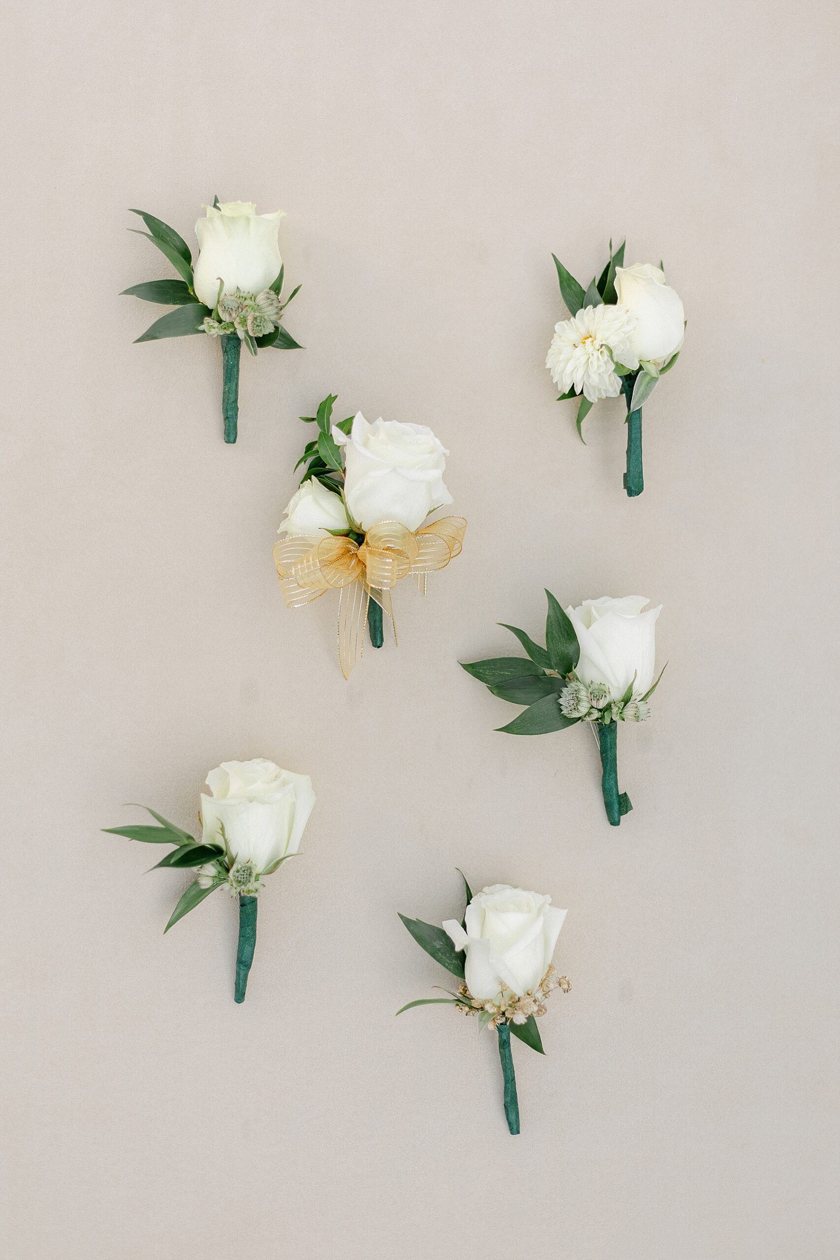 ivory and green boutonnieres