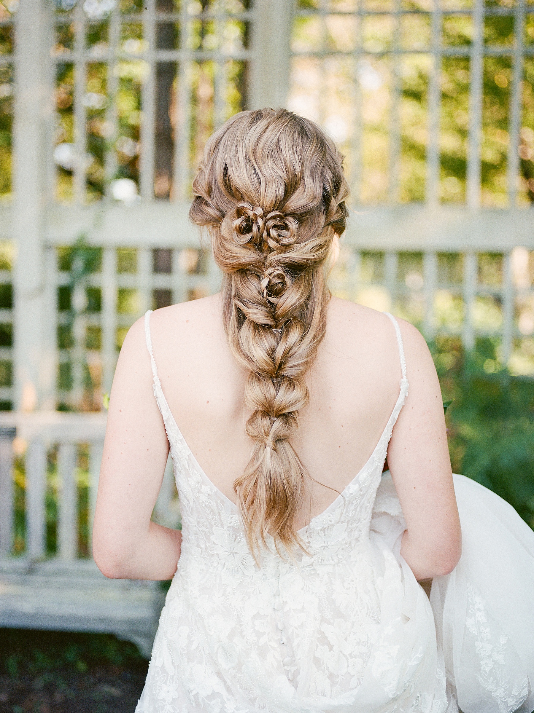 bridal hair loose braid rosettes