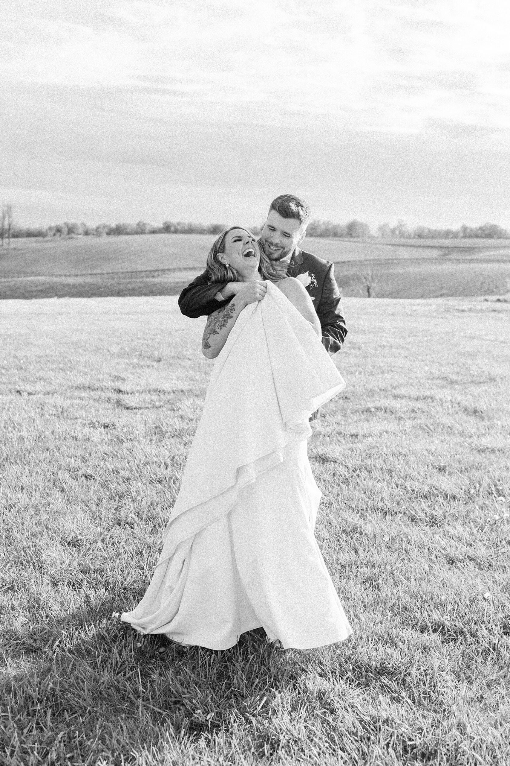 laughing bride and groom