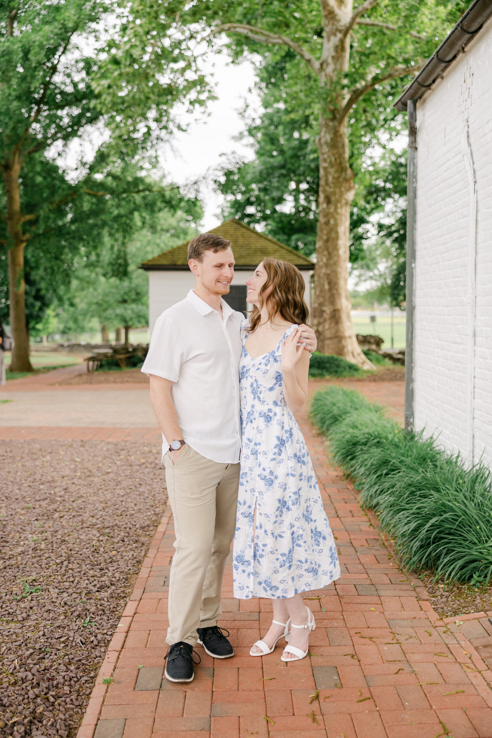 Wide shot engaged couple historic Rose Hill Manor Park grounds Frederick Maryland — Brittany Thomas Photography