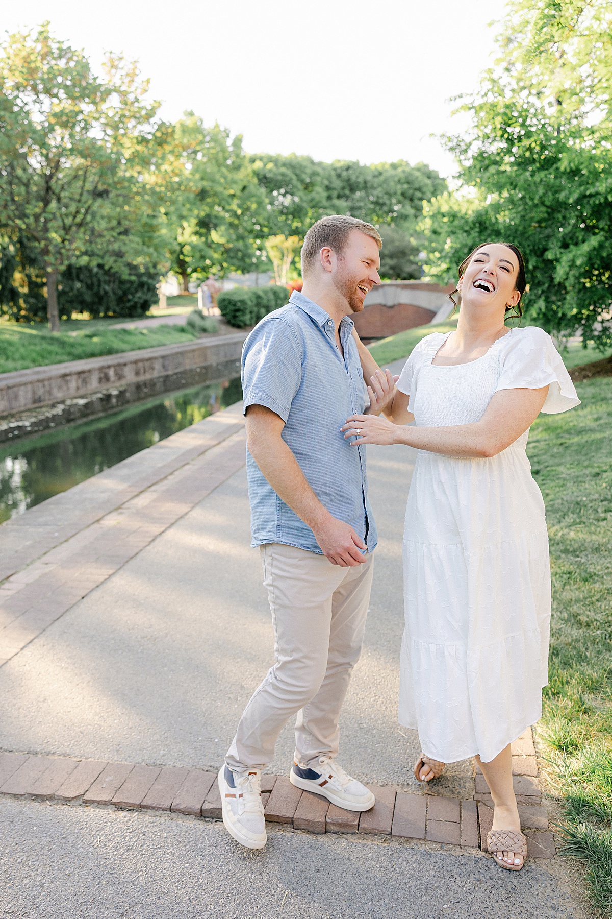 Playful candid engagement portraits downtown Frederick Maryland golden hour — Brittany Thomas Photography