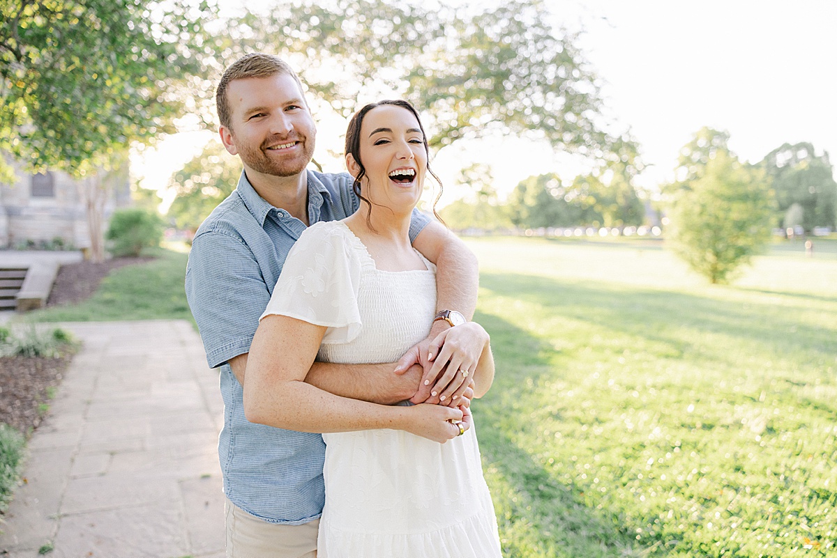 Engaged couple walking Baker Park bridge Frederick Maryland golden hour — Brittany Thomas Photography