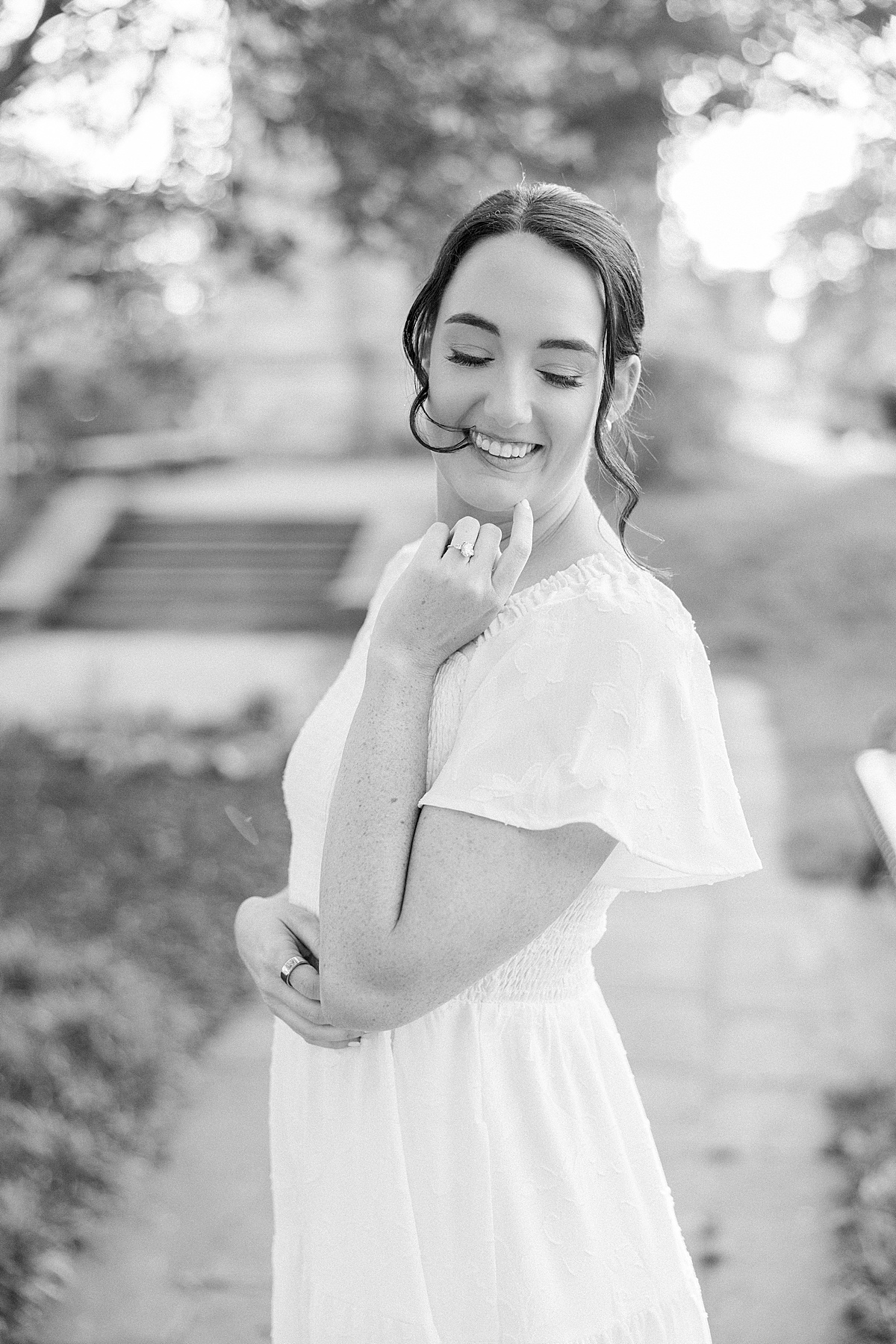Candid laugh Baker Park fountain downtown Frederick Maryland engagement session — Brittany Thomas Photography