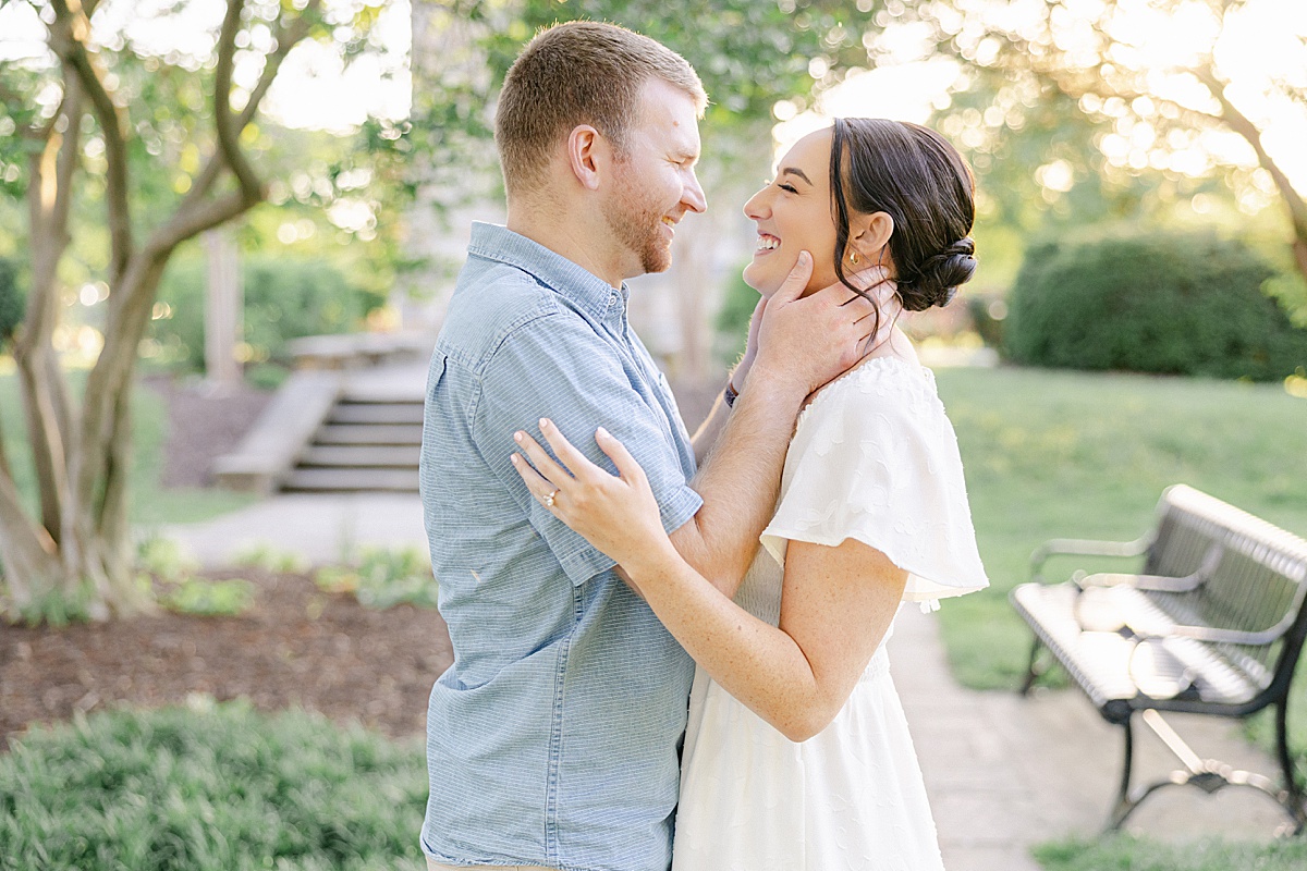 Engaged couple walking Carroll Creek downtown Frederick Maryland — Brittany Thomas Photography