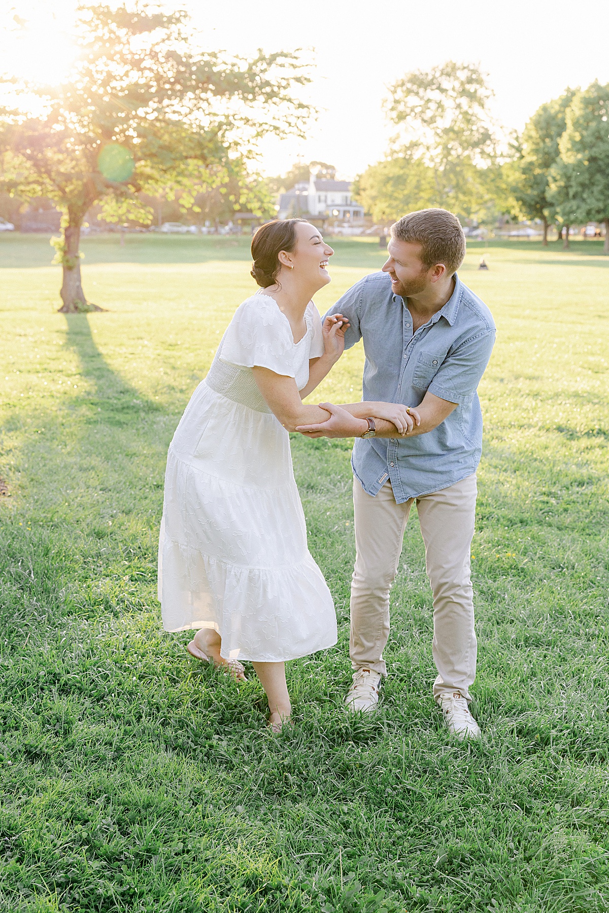 Engaged couple walking Carroll Creek downtown Frederick Maryland — Brittany Thomas Photography
