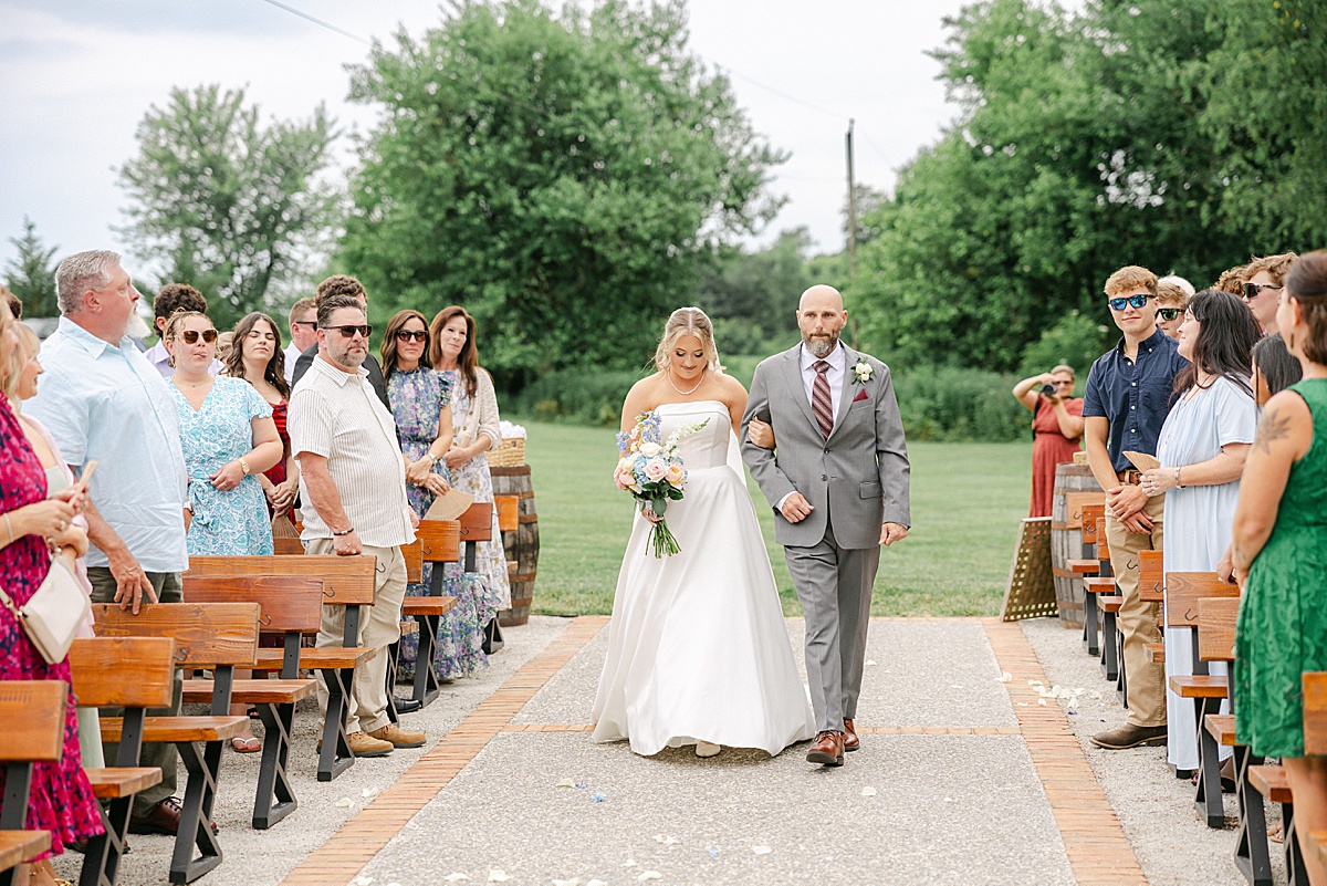 Father of the bride escorting daughter down the aisle at historic Maryland venue | Brittany Thomas Photography Maryland Wedding Photographer
