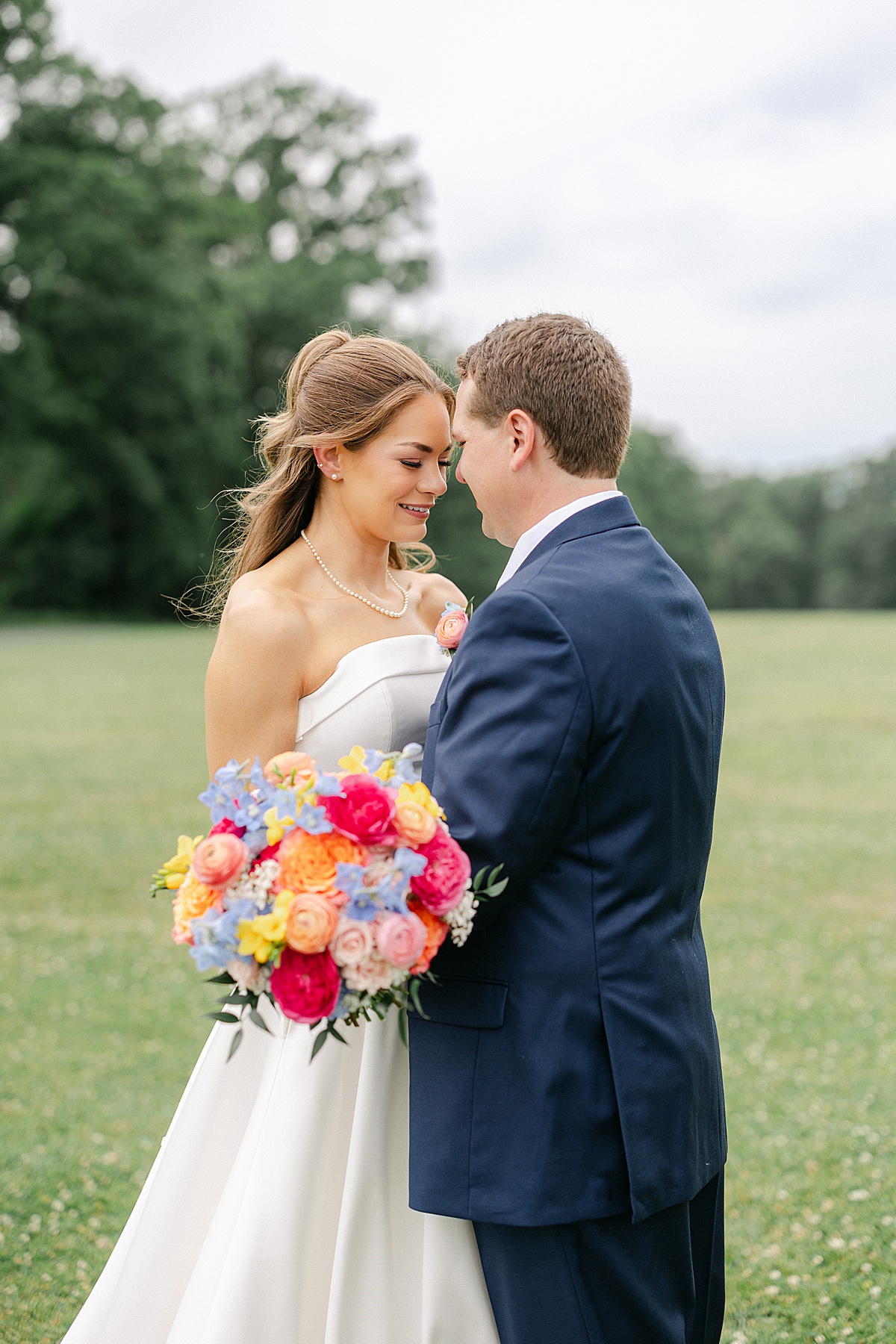 Close up of colorful wedding bouquet with pink orange and blue blooms at Maryland wedding | Brittany Thomas Photography Maryland Wedding Photographer